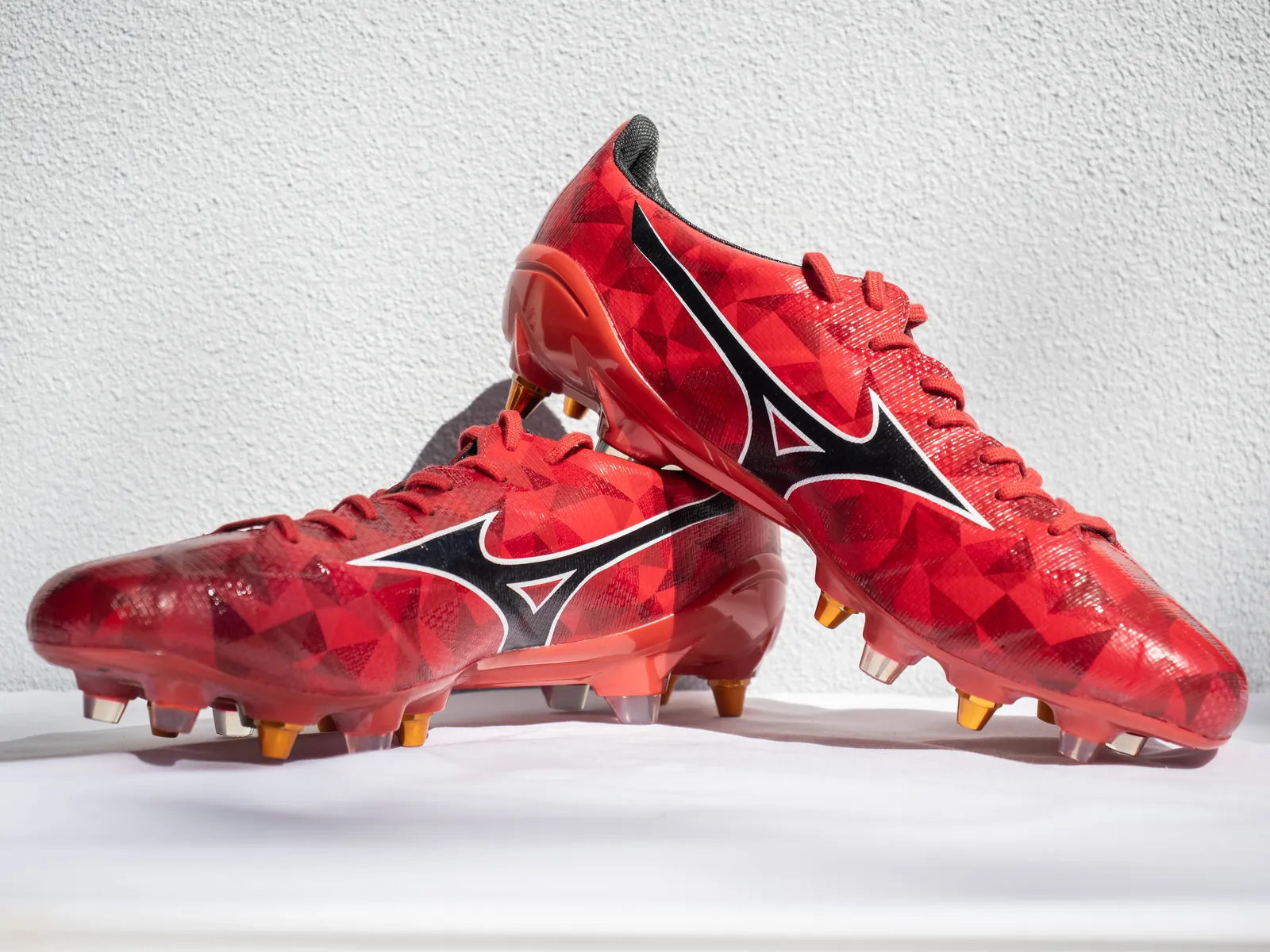 Pair of red Mizuno Alpha 2 Japan 40th Anniversary football boots